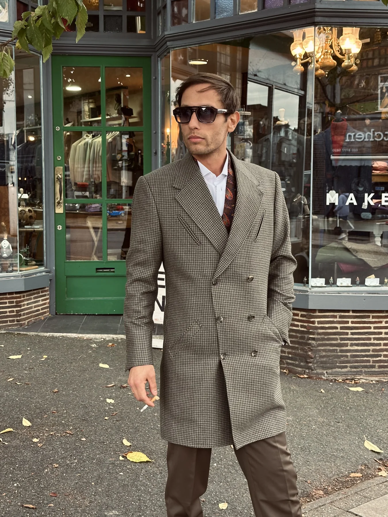 George Laing outside a London tailor’s shop