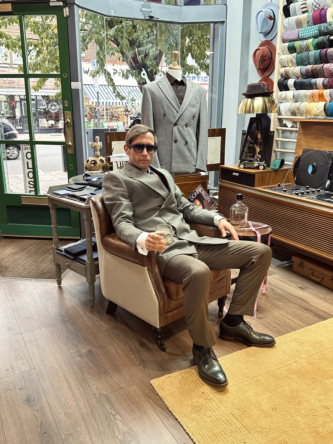 George Laing seated in a London tailor’s studio